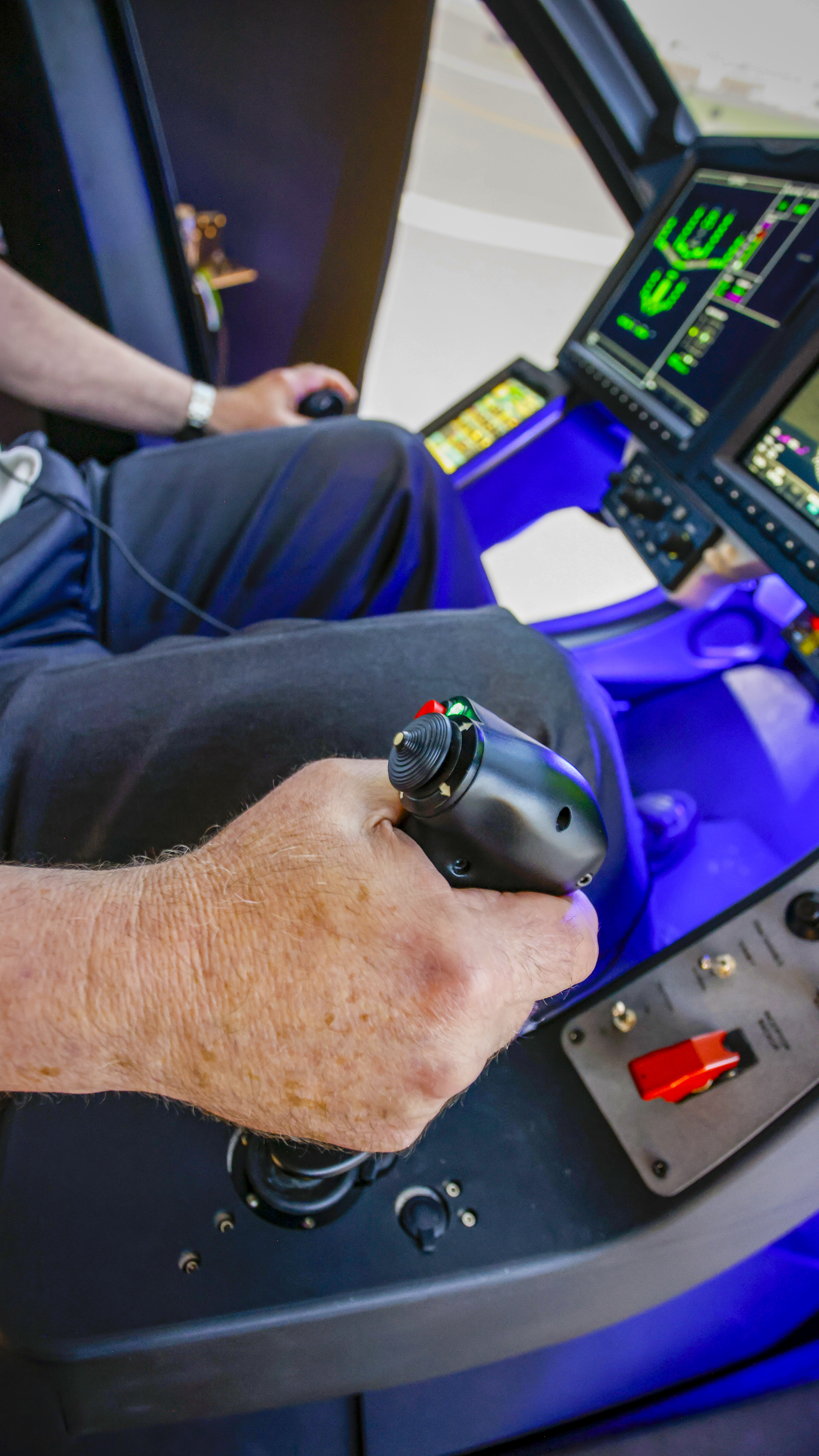 Grabbing a handful of inceptors  at the Marina, California, facilities’ simulator. A Garmin display screen shows representations of the S4’s powerplants, motors, and batteries. Green symbology means “A-OK.”