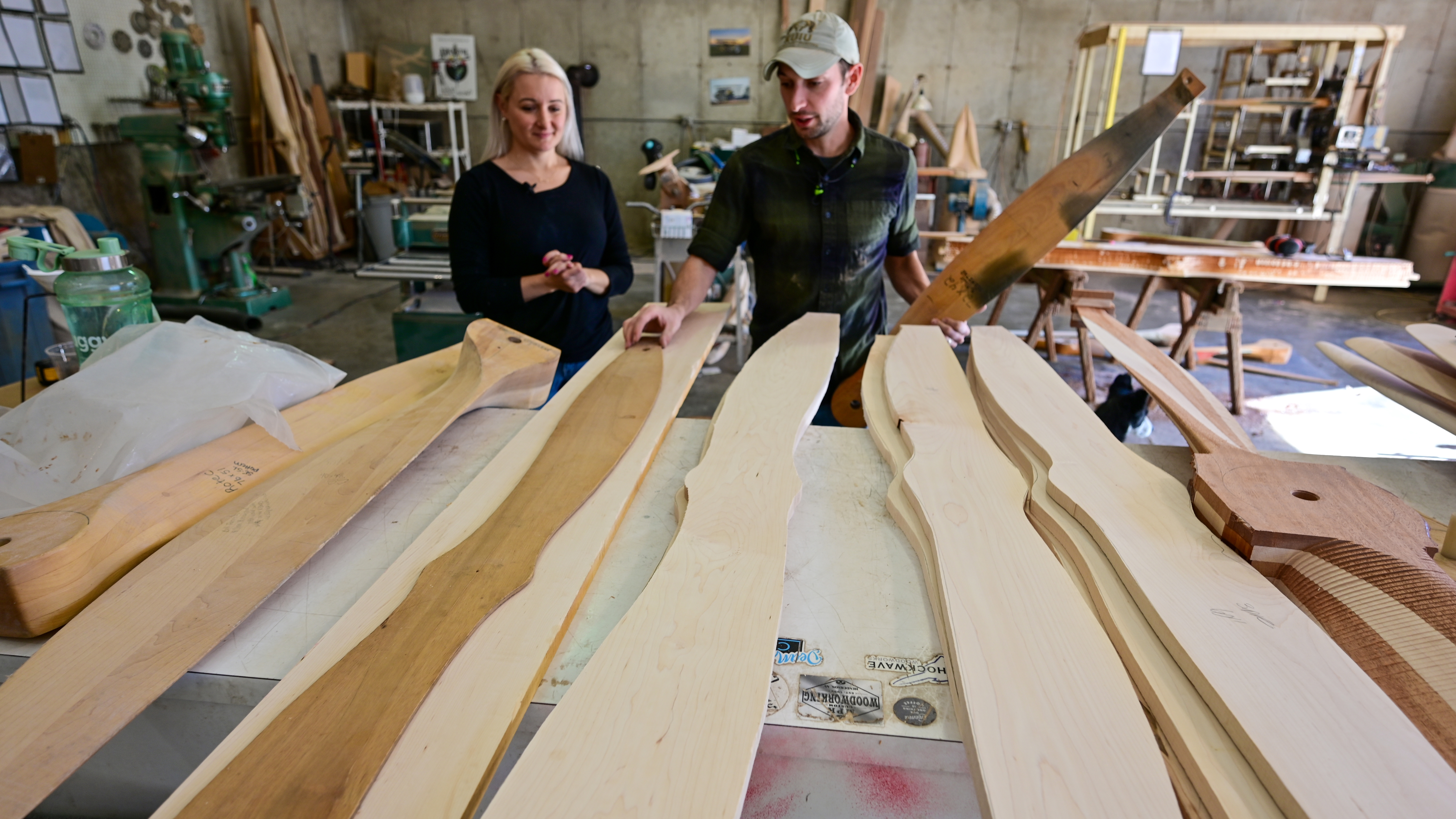 Alaina Lewis and Grant Smith with a stack of propellers in progress. The two can make 175 props per year.
