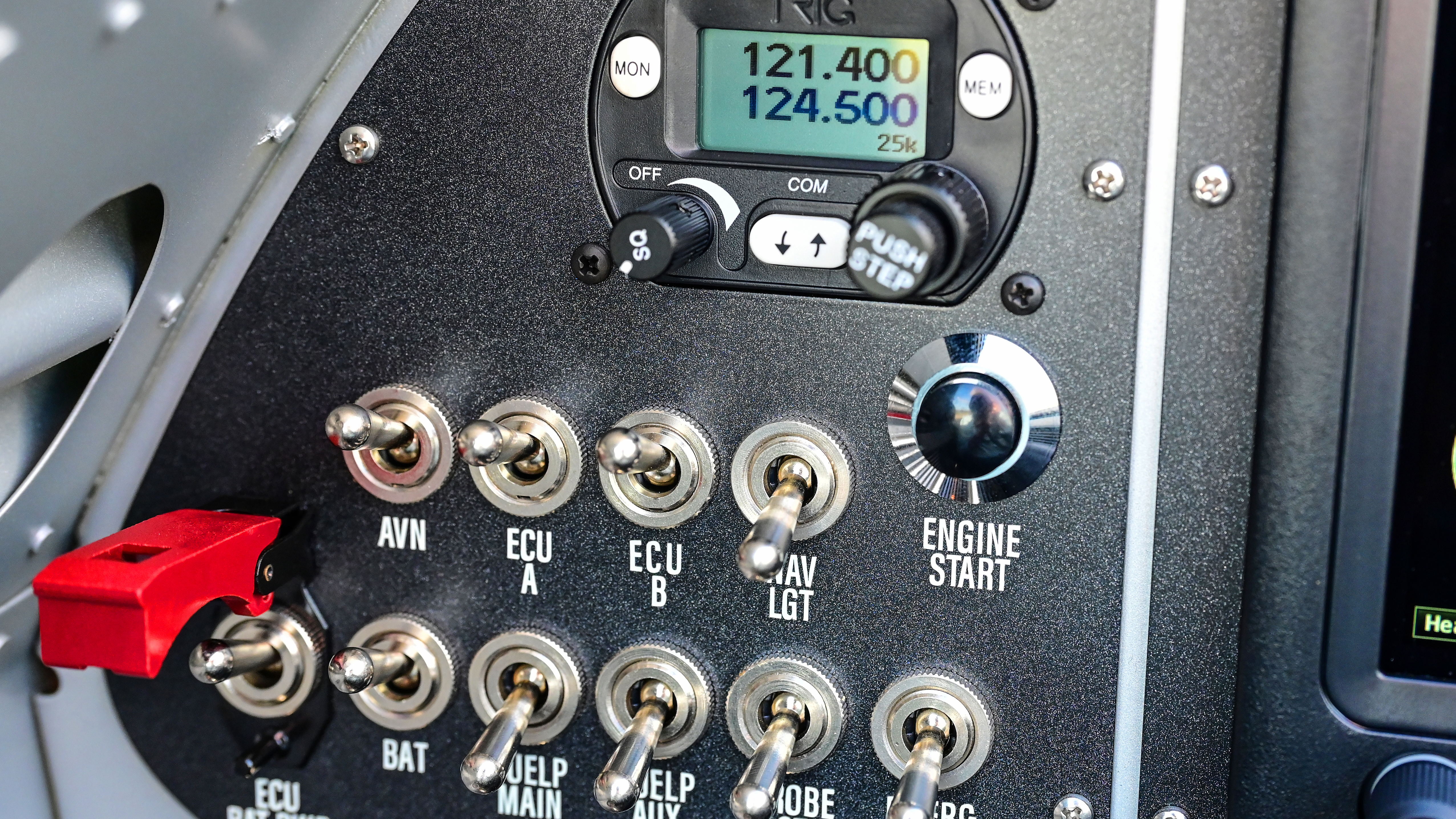 The aft seater’s electrical panel, with its dual-channel FADEC engine control unit switches, start button, and secondary com radio.