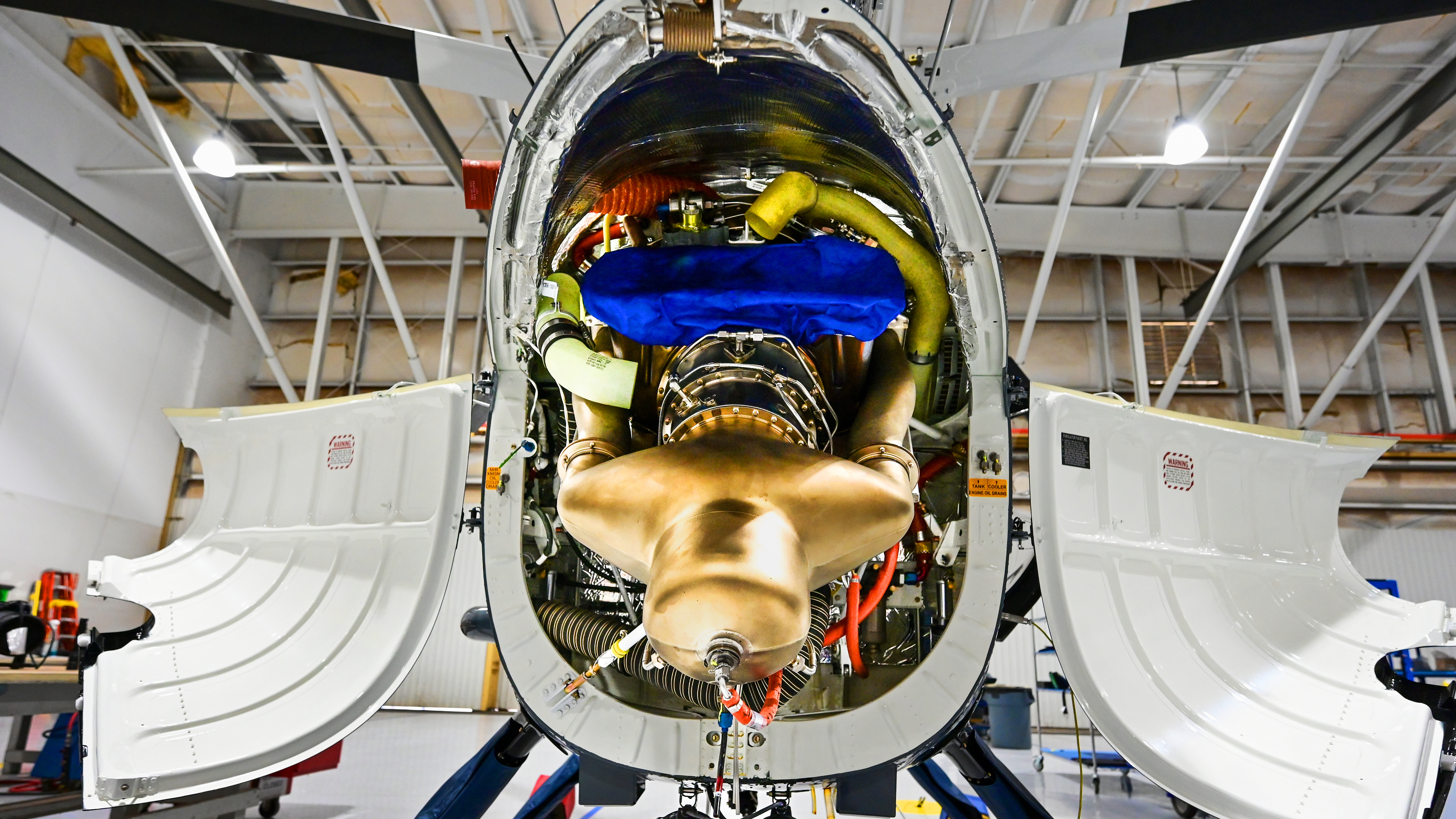 Clamshell doors open to allow access to the MD 500’s engine.