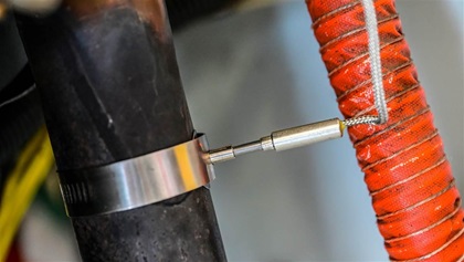 An EGT probe delivers temperature data to a monitor on the panel.