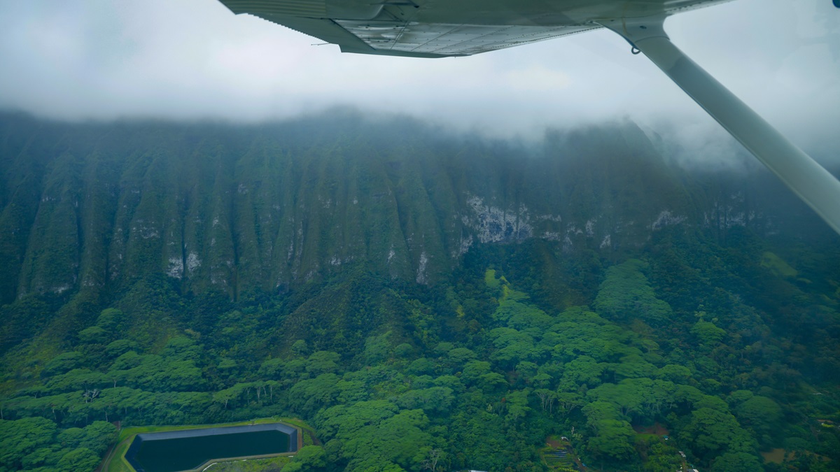 Mist covers the peak in Jurassic Valley; these mountains are actually the edge of a shield volcano.