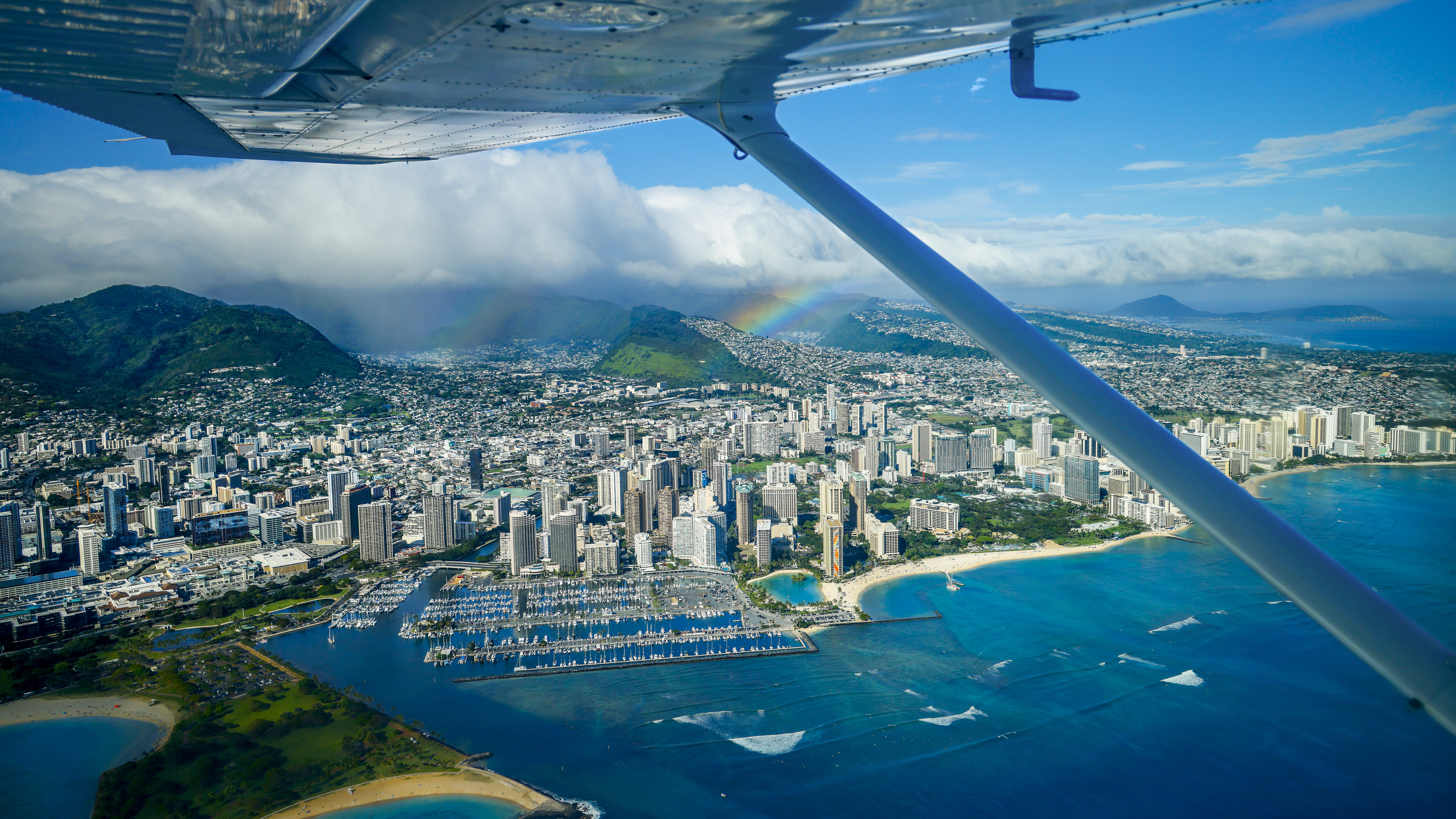 A rainbow greets us just after departure from Honolulu International over downtown Honolulu.