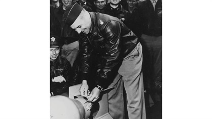 Gen. James Doolittle prepares a bomb before the raid; note the watch on his left wrist. U.S. Naval Institute