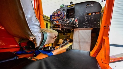 A metal plate affixed to the right instrument panel allows room for a backwards-sitting jumpmaster near the exit door and also protects the right side rudder pedals from unwanted movement.