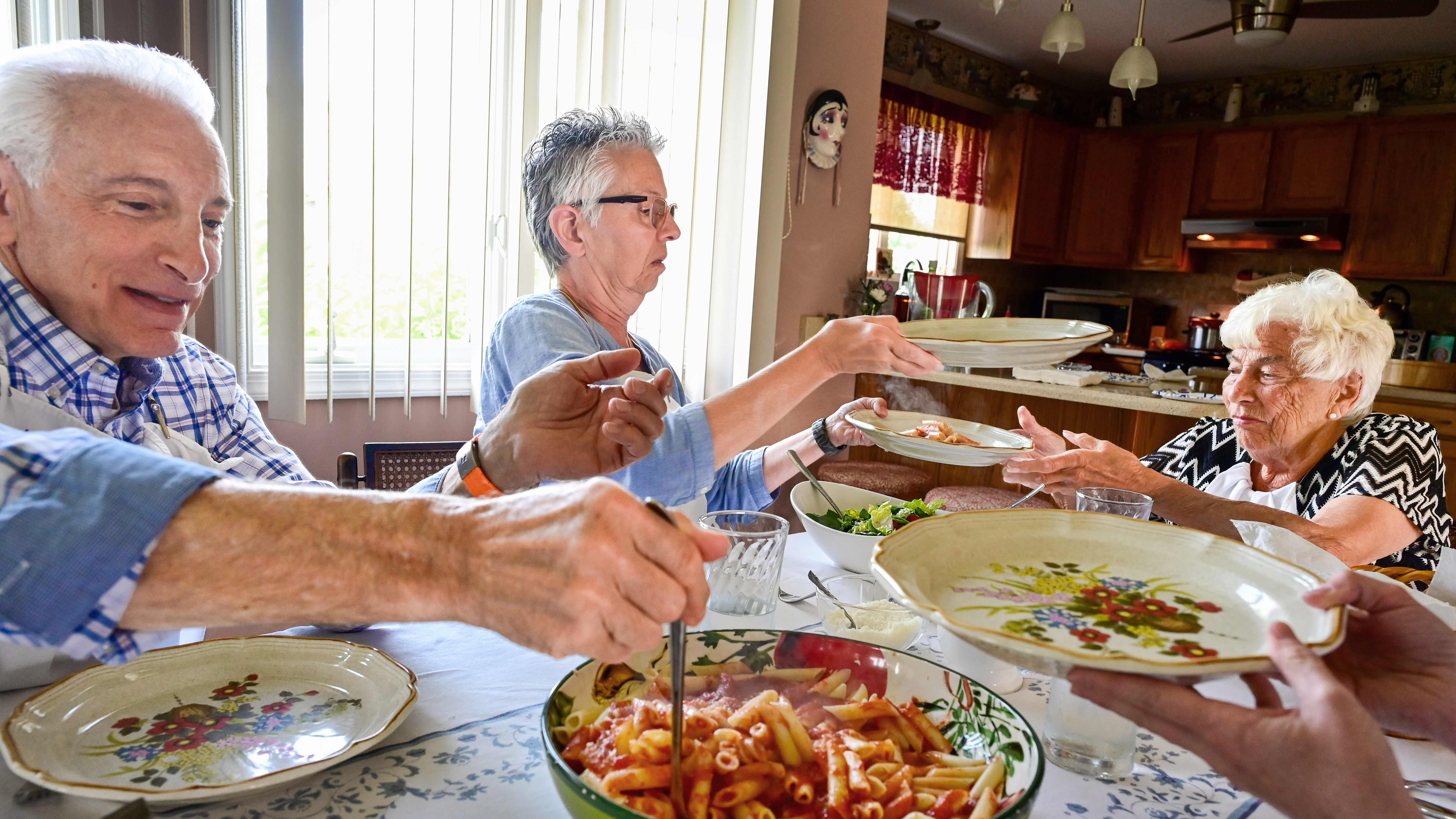 Masone rarely misses Sunday dinner with his mom, Jean. Today’s menu: pasta, homemade meatballs, and salad.