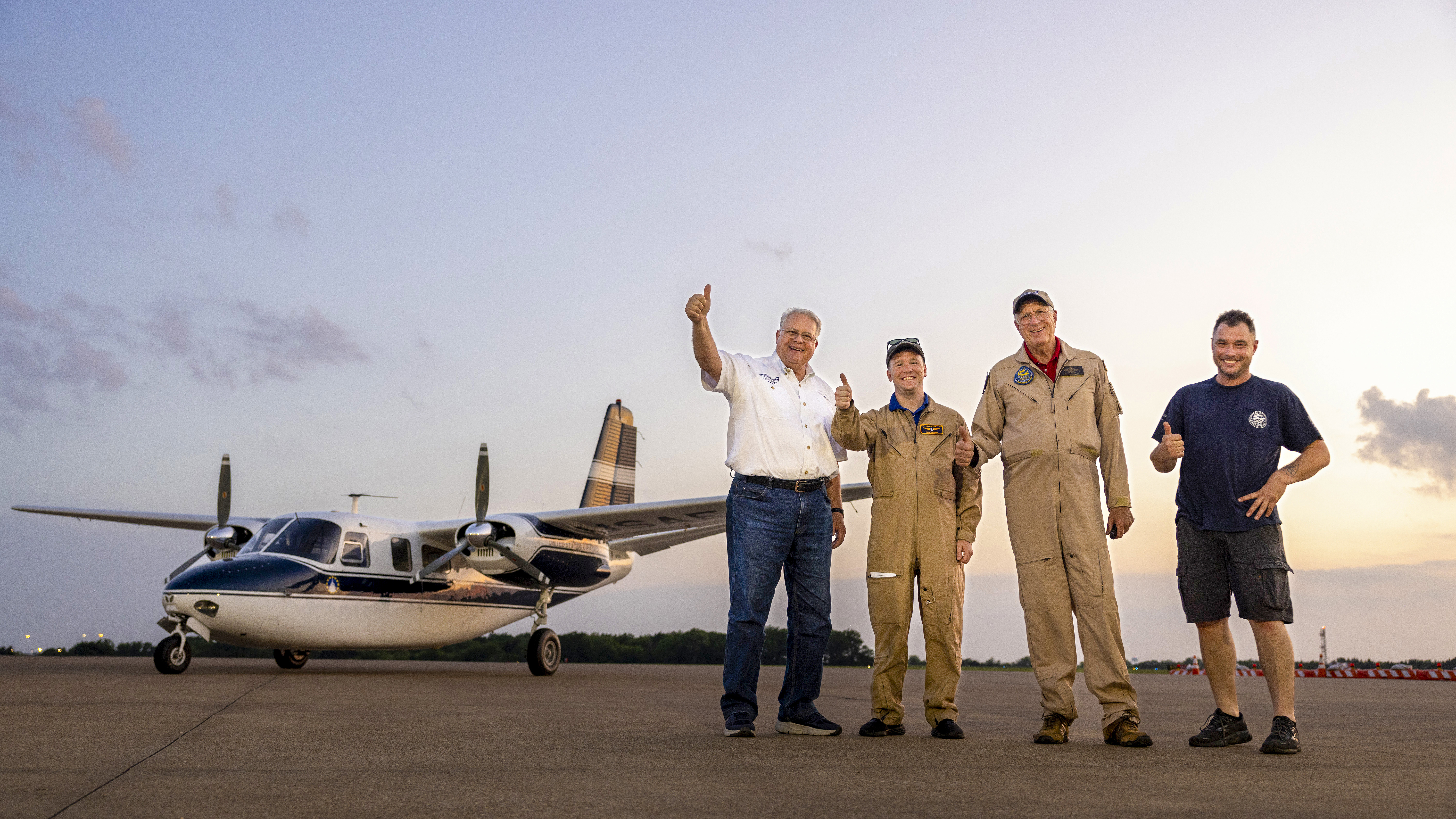 left to right: Gerald Oliver, camera ship pilot Paul Downing, instructor pilot William Goeken, and crew chief Matt Pedron.