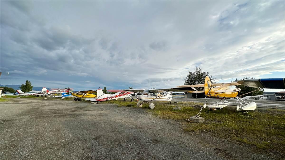 Despite the harsh weather, a chronic shortage of hangars compels many Alaskan pilots to leave their airplanes outside year-round as they do here near the gravel runway at the Lake Hood Seaplane Base.