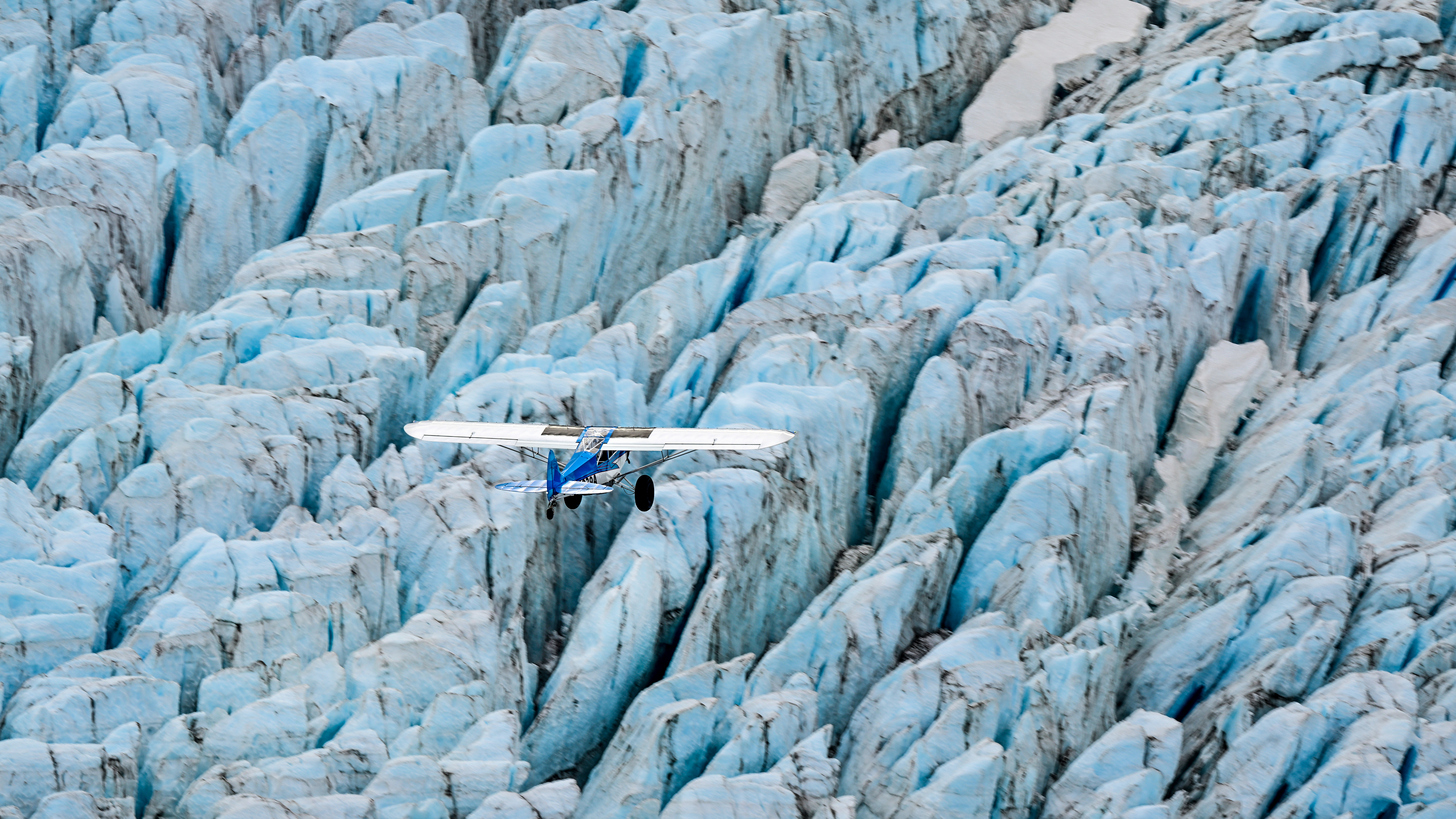 Alaska pilot and Super Cub owner Patrick Carter takes his big-tire airplane on a local flight over the glaciers near Homer.