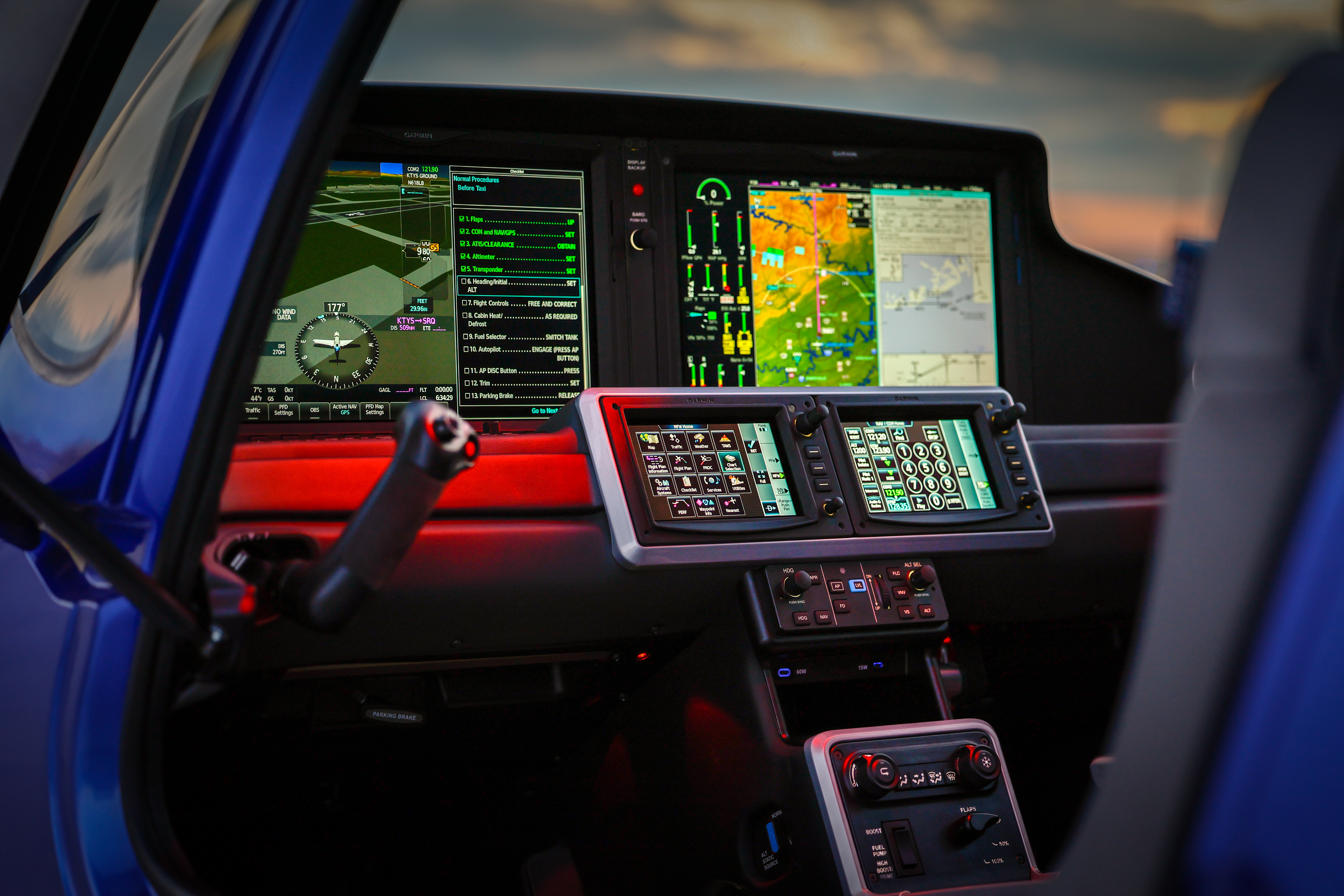 Below the touch-screen controllers are the autopilot controls, USB ports and a storage space, environmental controls, and a flap position switch. Photo by Chris Rose.
