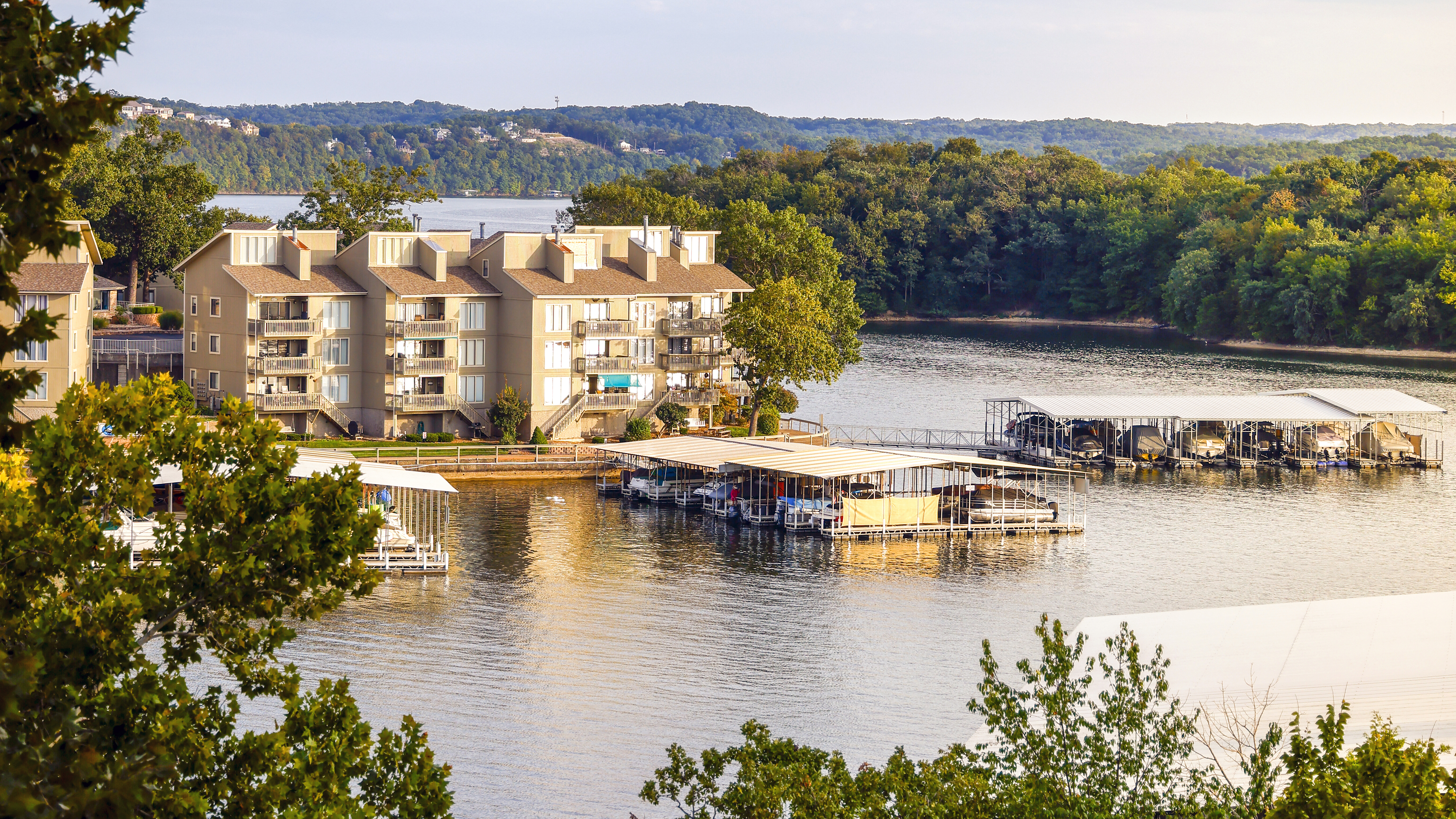 Lakeside views abound at Lake of the Ozarks, whose massive surface area includes a main lake that sees a lot of boat activity, four branches or “arms,” and many quiet little coves where visitors and residents can swim, fish, and play.