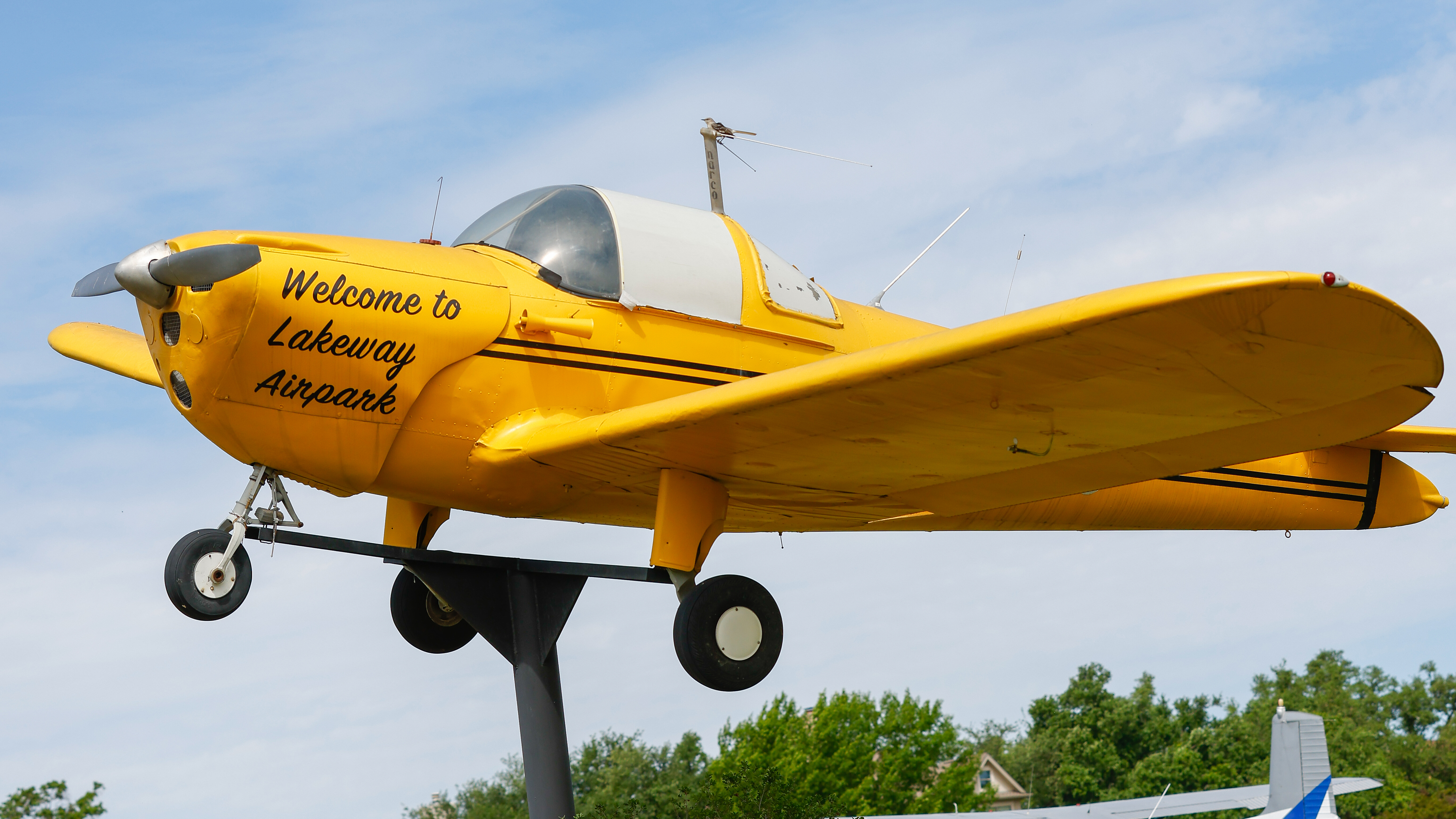 The “Airport Mascot,” a yellow Ercoupe mounted on a pole at the airpark’s entrance, was trucked from Oklahoma to Texas by former Lakeway Airpark resident BD Thompson.