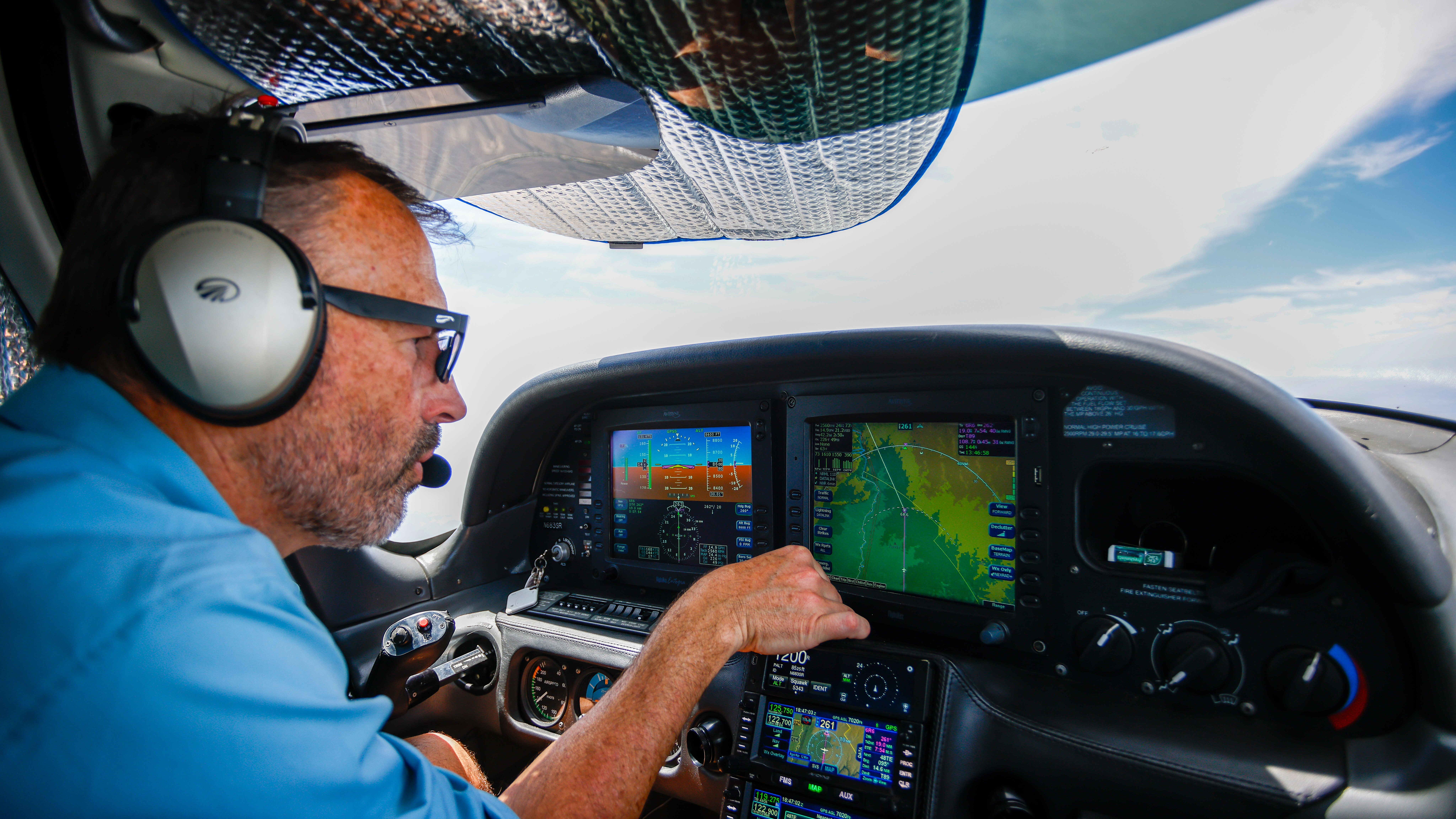 Pilot Brent Pickette maps out our route across the mountains.
