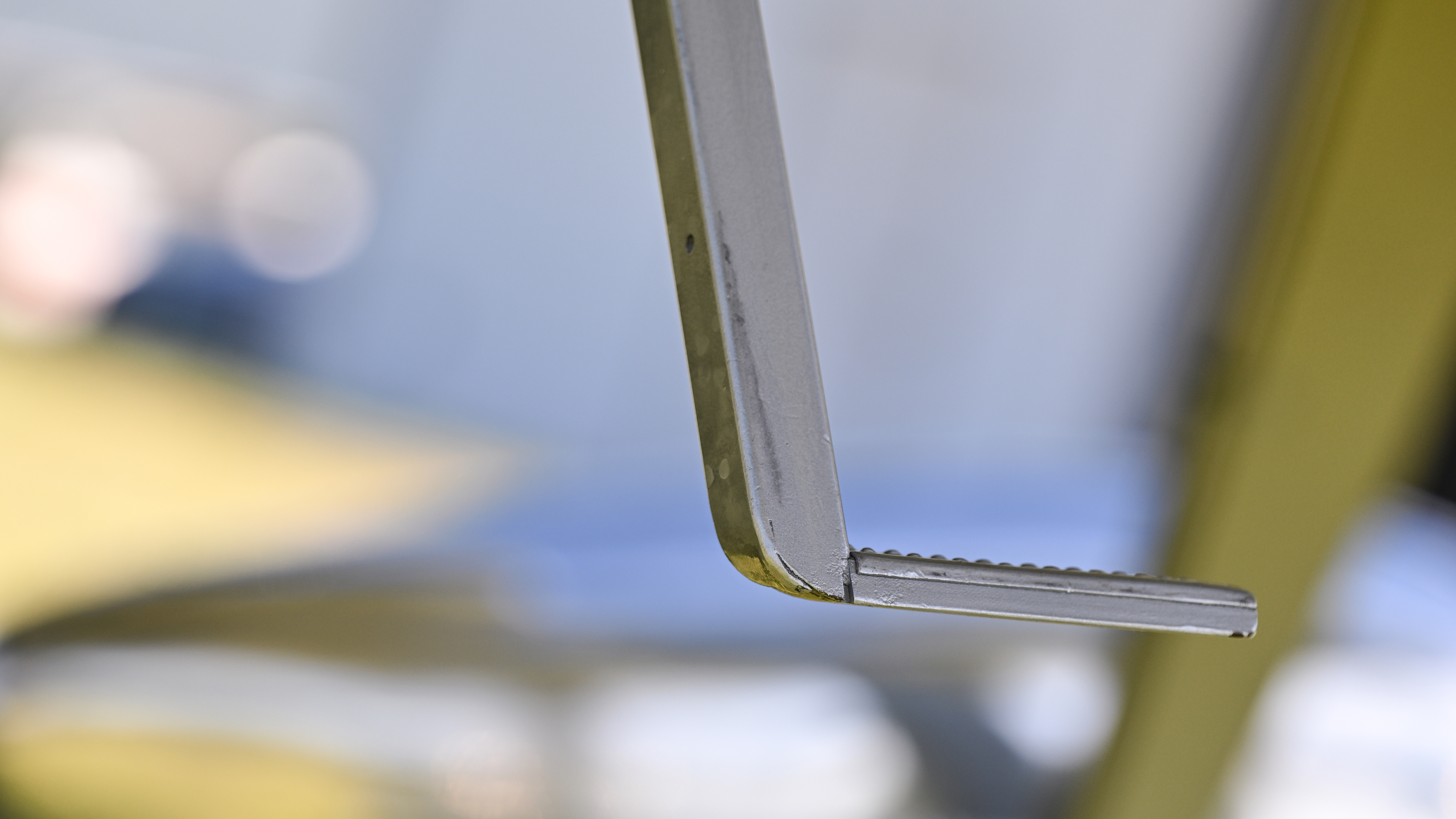 A footstep swings down from the fuselage to aid entry.