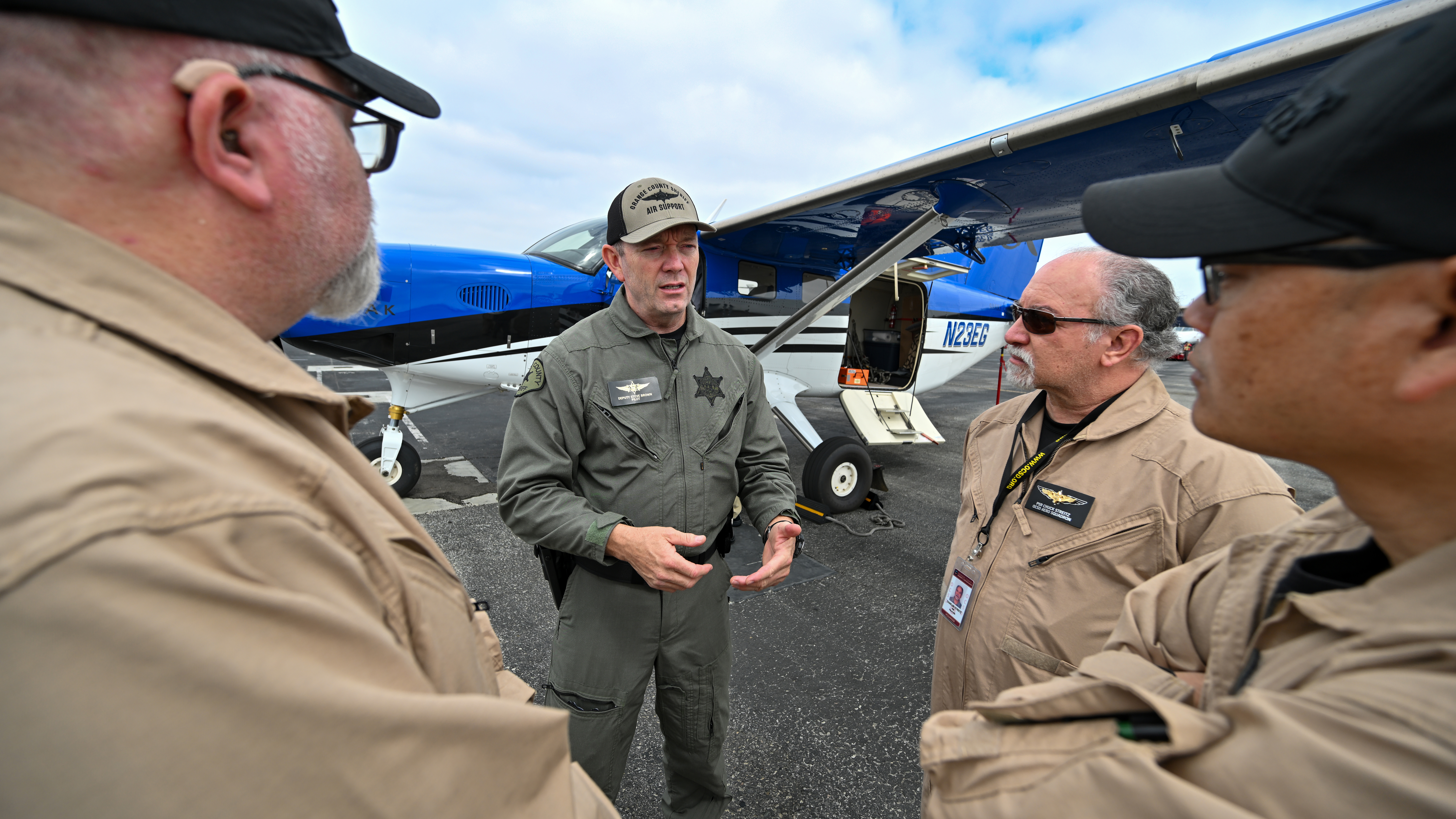 Unit Commander, Reserve Lt. Steve Brown, leads a pilot briefing for a planned training mission.