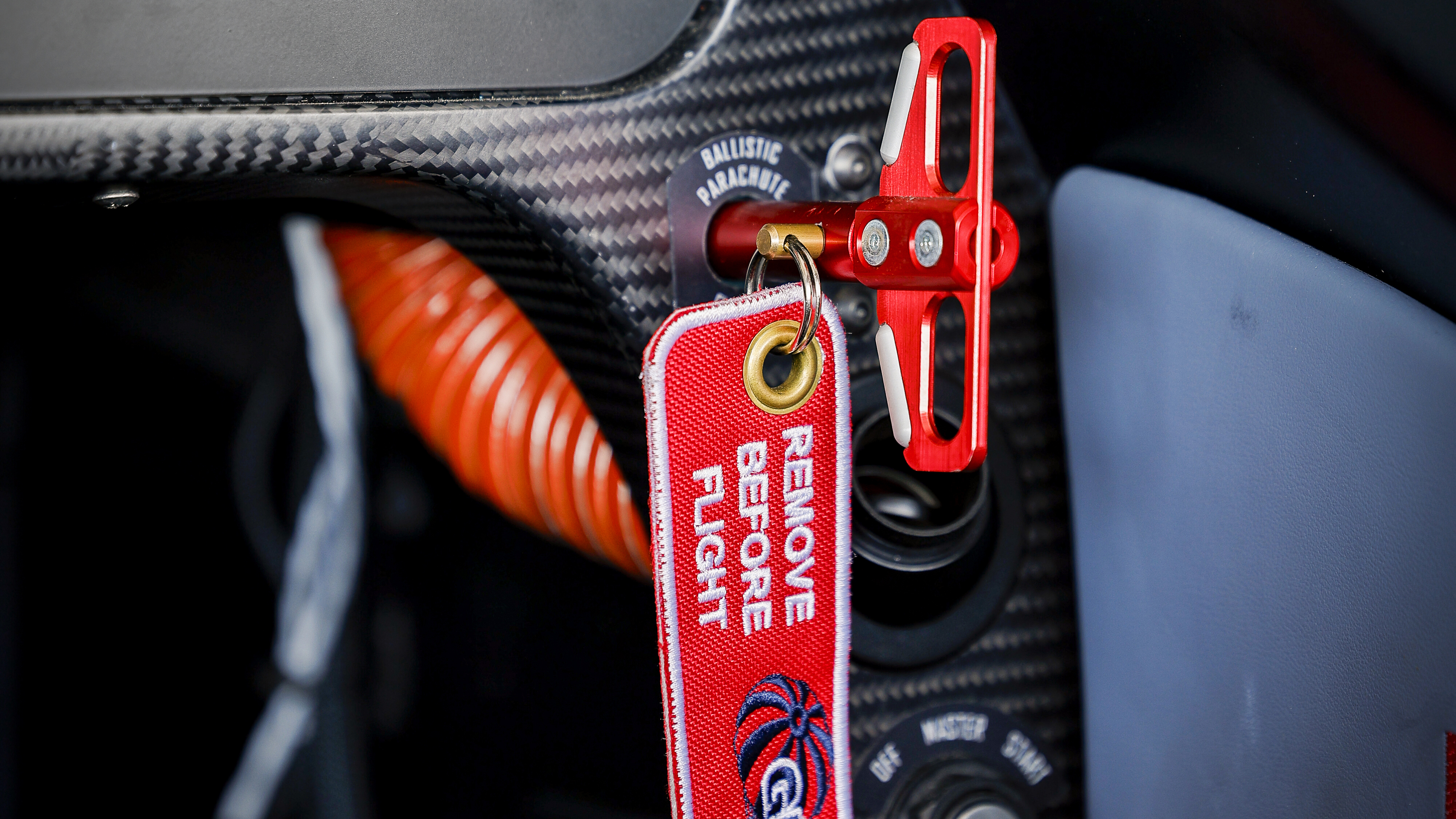 A ballistic airframe parachute system can be deployed via the pinned red handle on the lower right side of the instrument panel. 
