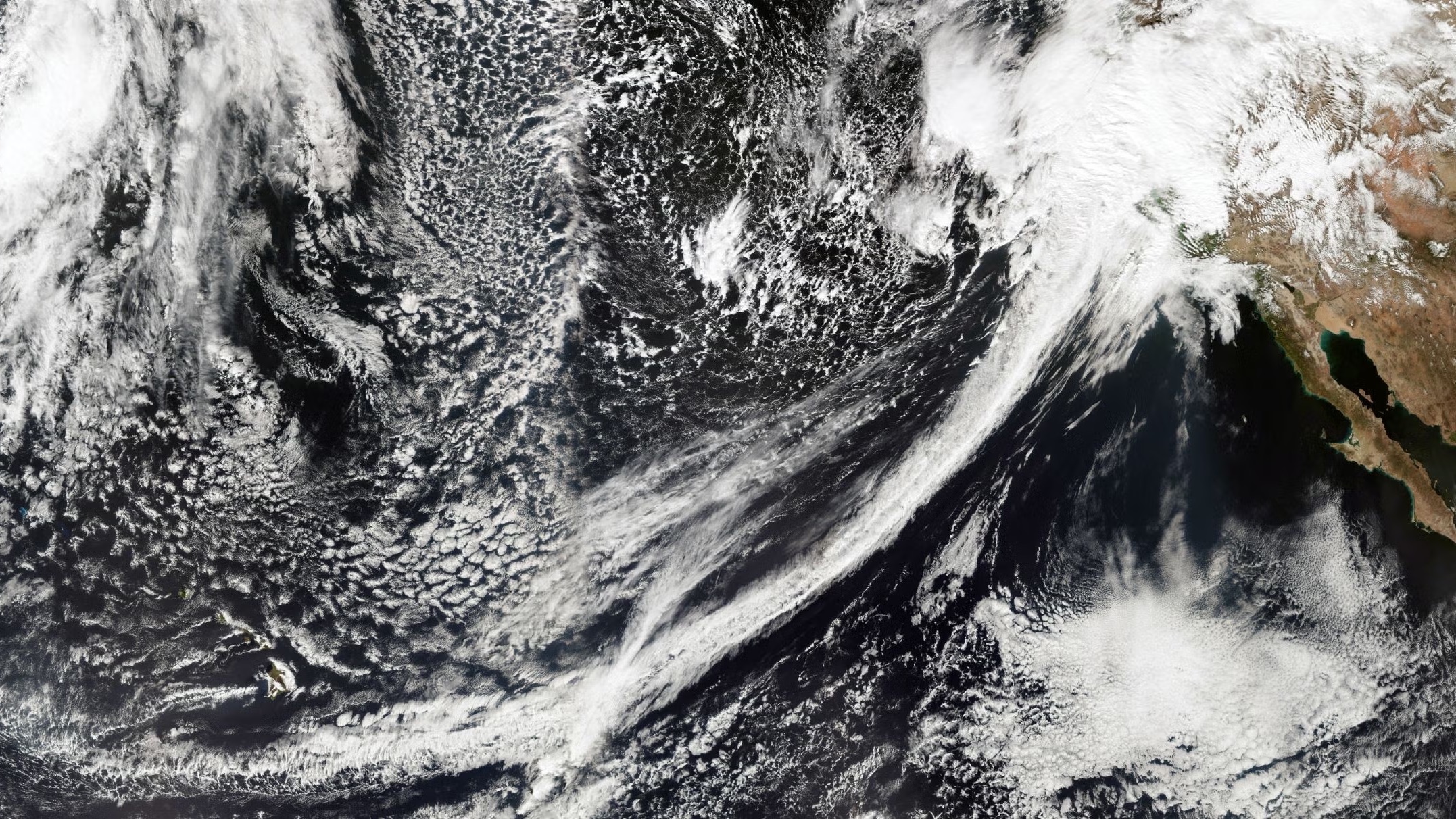 A geostationary satellite image shows that atmospheric river plumes can span the Pacific Ocean.
