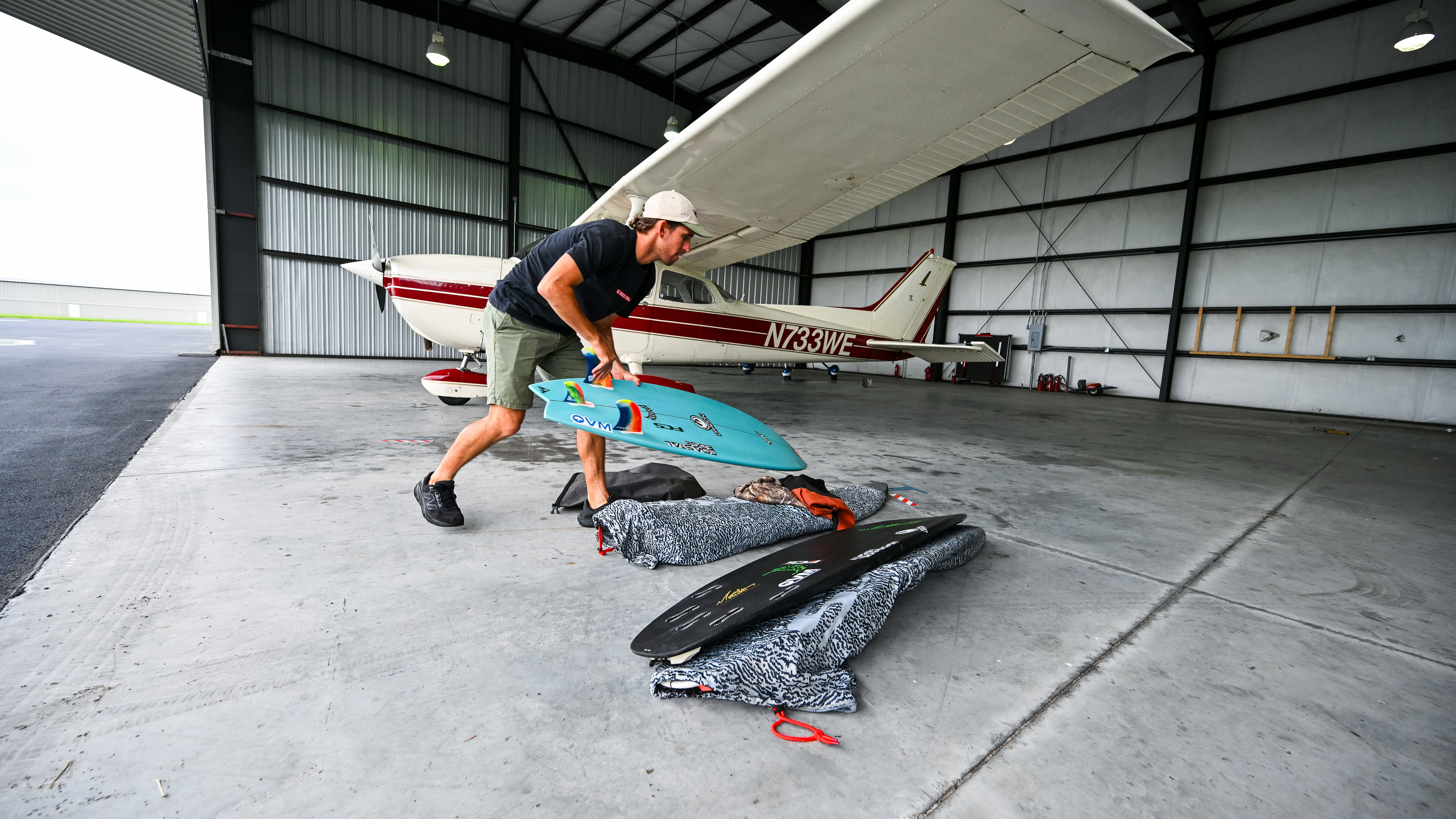 He takes out the back seats to store his gear and quiver of boards to fly himself to surf spots and competitions.