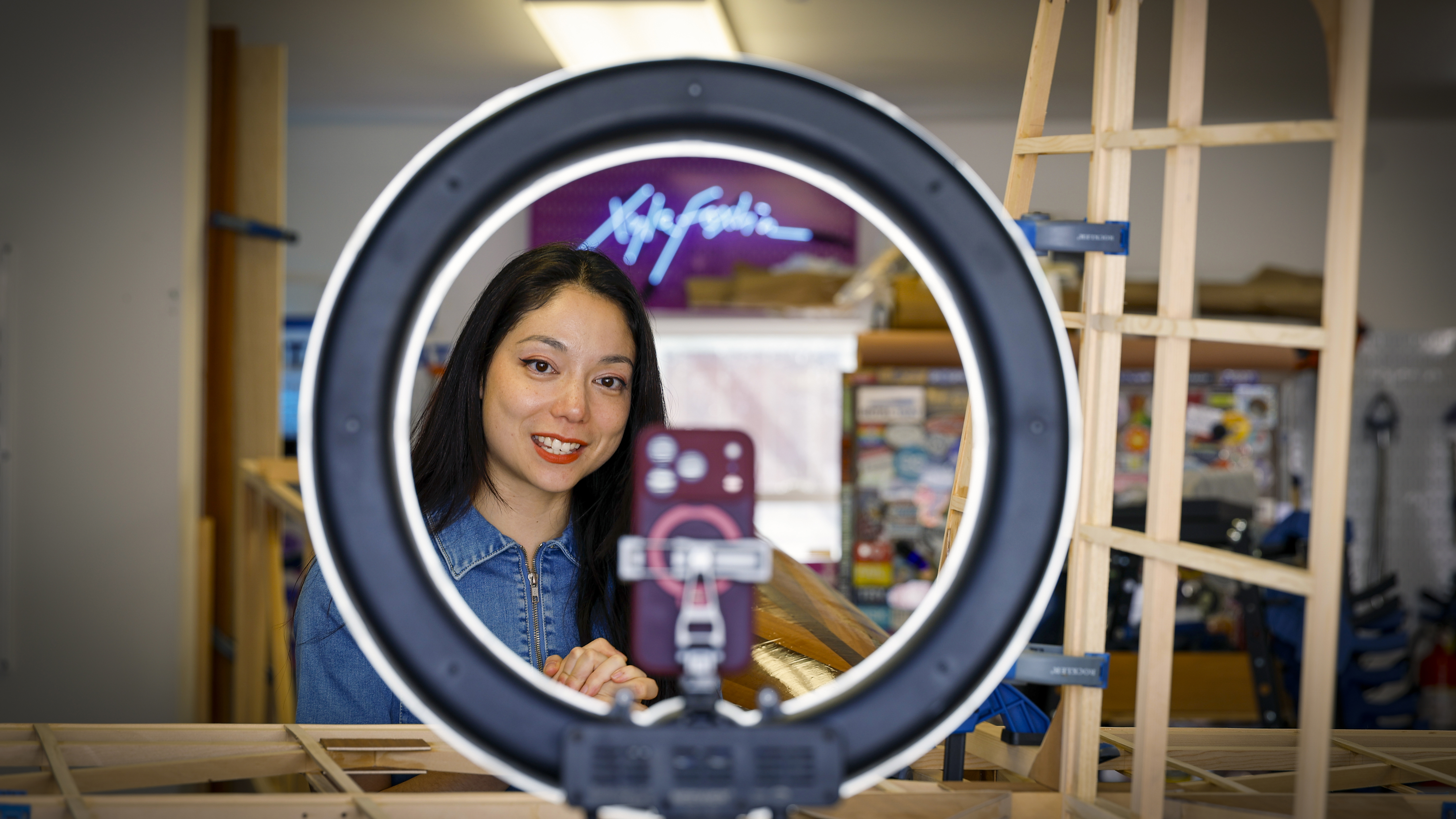 Foxlin’s studio garage, gear, and footwear reflect her love of space, aviation, and raccoons. She intentionally includes traditionally feminine touches throughout her workspace. Photo by Chris Rose