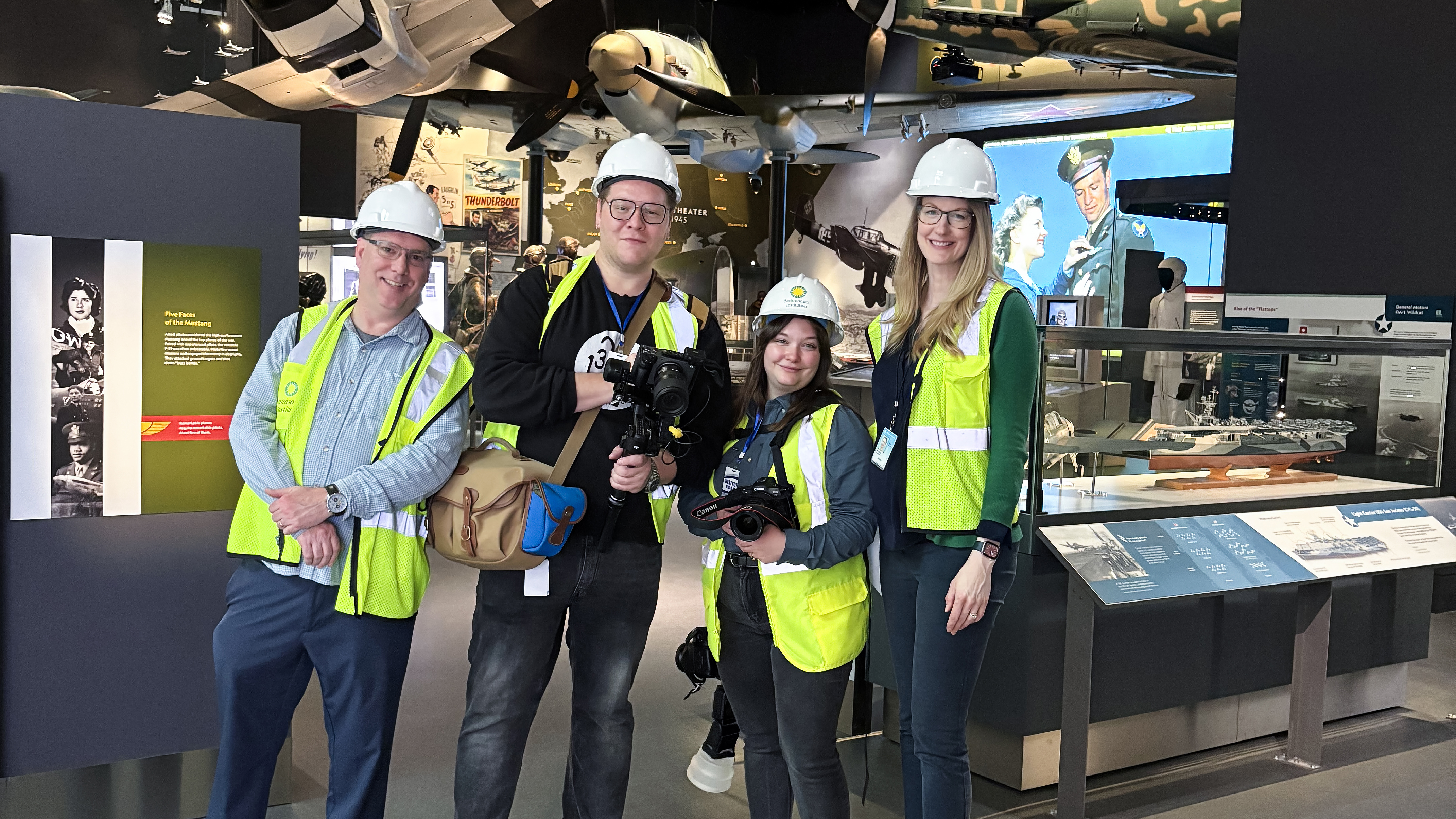 Curator Roger Connor, AOPA videographer Jake Teague, photographer Rebecca Boone, and Smithsonian Deputy Director of Communications Alison Wood in their protective gear.
