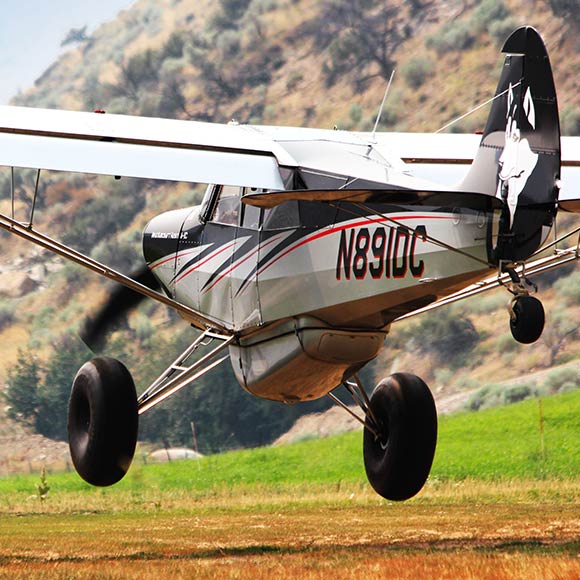 Aviat Husky Aircraft Coming in for a landing in the backcountry