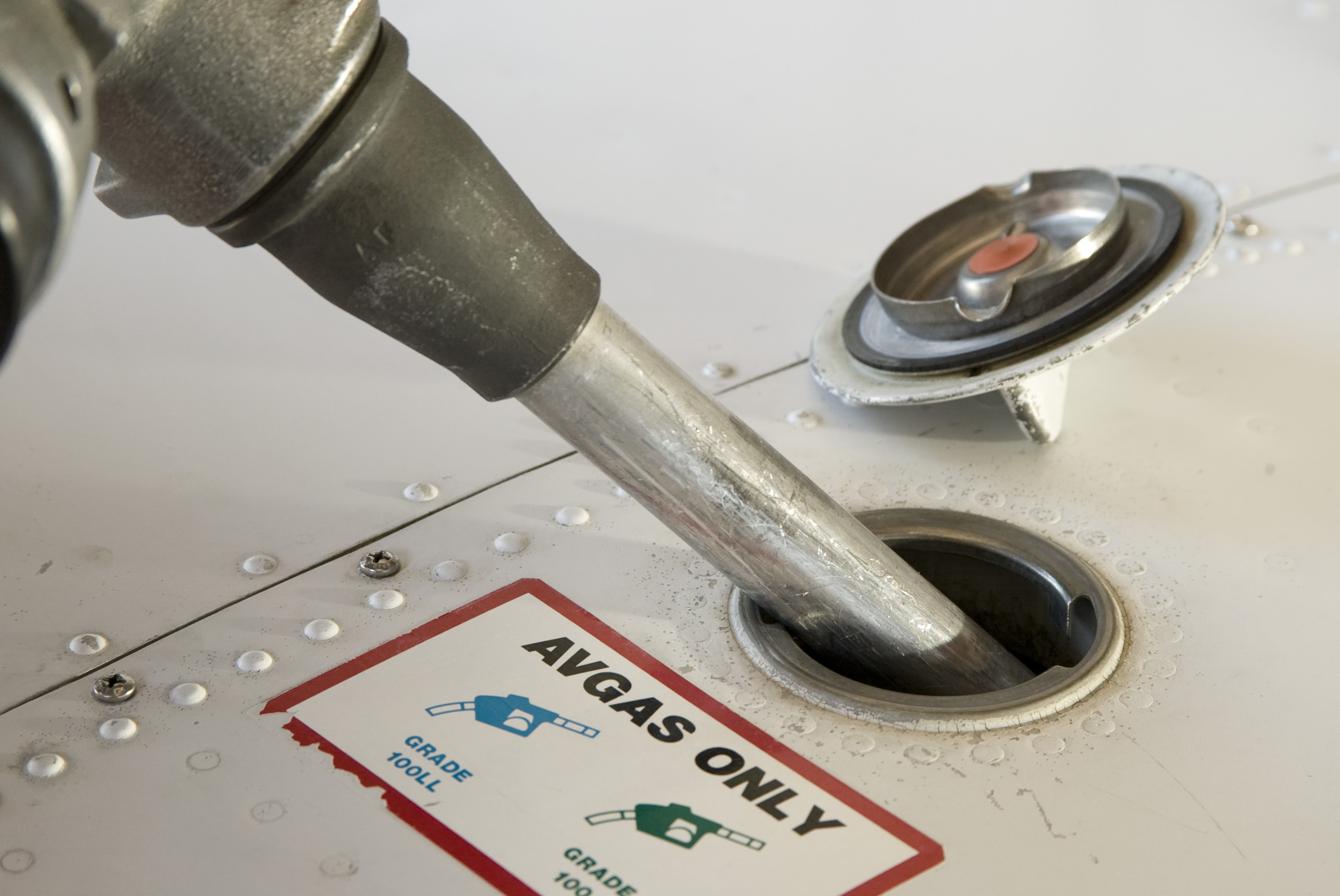 Fuel nozzle and fuel tank on a Cessna 712 Skyhawk.
Wichita, KS   USA
Image#: 04-350_030.TIF   Camera: Canon EOS-1D 
