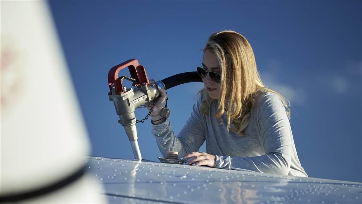 Model Thea Botezan fueling a Cessna 177 Cardinal at Atlas Aviation. Peter O'Knight Airport (TPF)Tampa FL USA