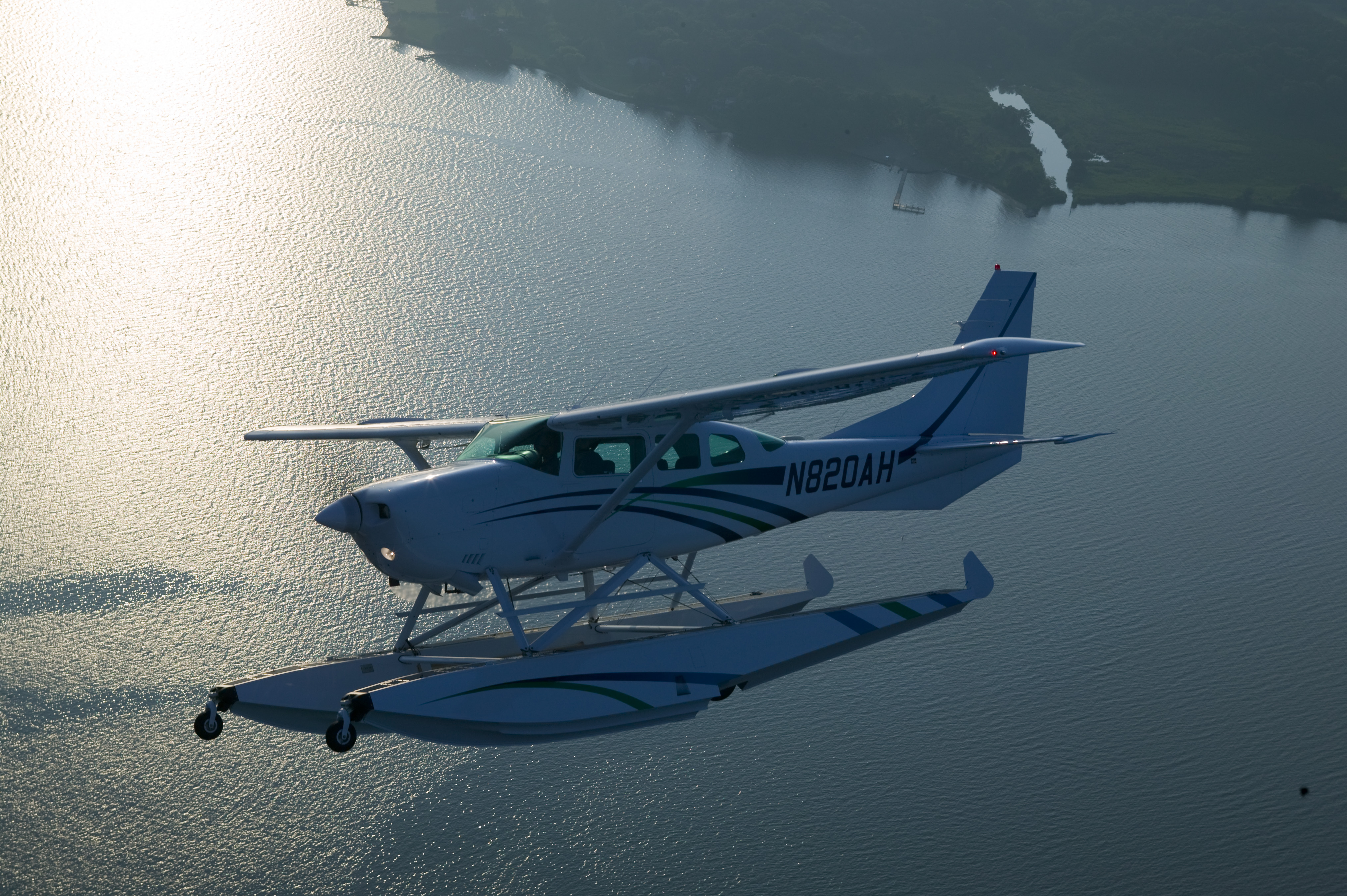 Aerial photography of Bo Hixon's 1981 Turbo U206, which has undergone the full Wipaire refurb with Wipline 3450 floats, Robertson STOL and co-pilot door over the Southeast Creek on Maryland's Eastern Shore.Church Hill, MD   USAImage#: 04-366_201.tif     Camera: Canon EOS-1DS 