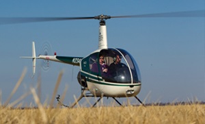 Helicopter in field preparing for take off