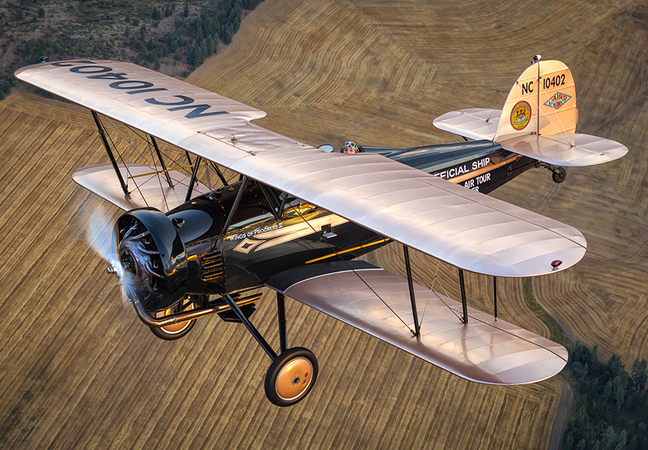 A 1930 Laird is captured in mid-flight during a break in stormclouds that washed the aircraft in pleasing light. Photo by Jay Beckman. 