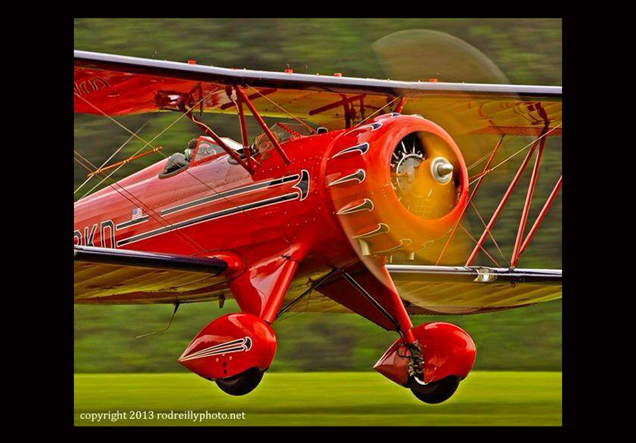 A Waco biplane evokes movement as it takes off from Georgia's Candler Field. Photo by Rodman Reilly.