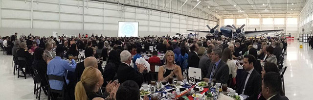 One of two Howard 500 aircraft on display provided a backdrop for the event.