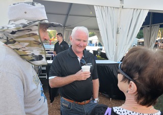 AOPA President Mark Baker talks with Carl Hillenbrand, left, and Lynda Mowry of Sandy Lake, Pennsylvania, before Wednesday's program. Mike Collins photo.