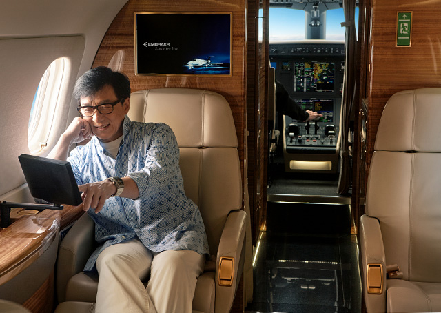 Brand ambassador, actor, and philanthropist Jackie Chan was the first customer in China to take delivery of the new Embraer Legacy 500 midsize business jet which features fly-by-wire technology, Rockwell Collins Pro Line Fusion avionics, and a flat-floor cabin for its eight passengers. Photo courtesy of Embraer.