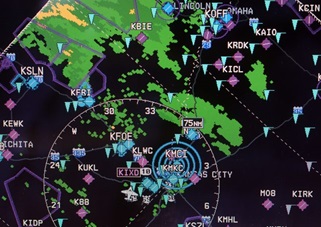 FIS-B weather on a G1000 display shows a winter storm heading toward Kansas City.