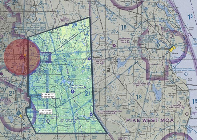 The Grayling TMOA will be uncharted, and pilots will be notified by notam when it is active during various dates between April and August, 2016. An exclusion depicted by a red circle in this composite image protects the June 18-19 airshow in Gaylord, Michigan, with a 6 nautical mile circle around the airport extending up to 12,500 msl to accommodate the airshow.  