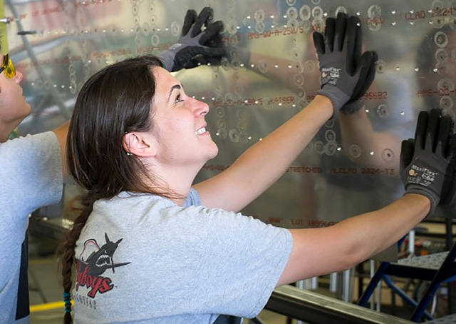 San Diego Miramar College airframe and powerplant student Genevieve Cindrich landed an internship with Delta Airlines in San Diego. Cindrich is helping restore a warbird in this photo. Photos courtesy of Genevieve Cindrich.