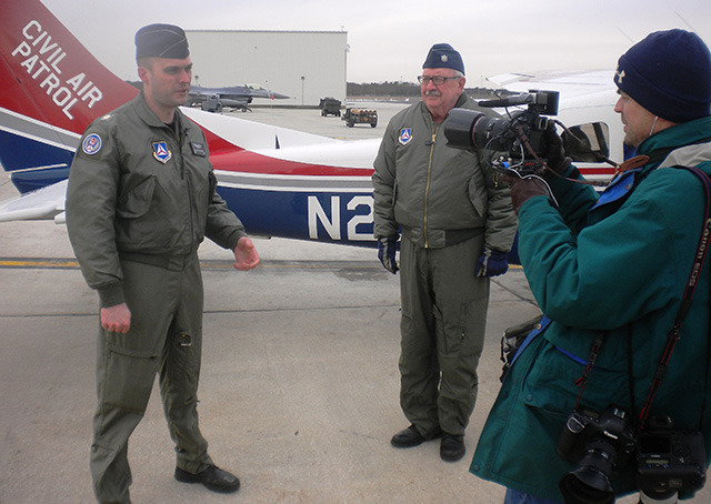 Civil Air Patrol Maj. Will Schlosser, left, mission observer, and Lt. Col. Douglas Glantz, pilot, are interviewed before flying a 2014 intercept training mission. Photo courtesy of 2nd Lt. Mike Gross, New Jersey Wing.