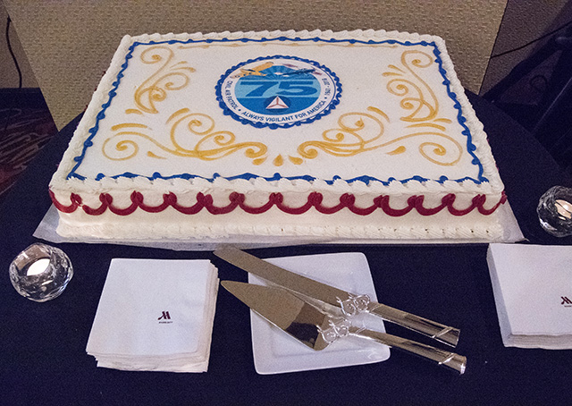 The Civil Air Patrol kicked off its seventy-fifth anniversary celebration with a large cake featuring a pair of observation aircraft on patrol. Photo by David Tulis.