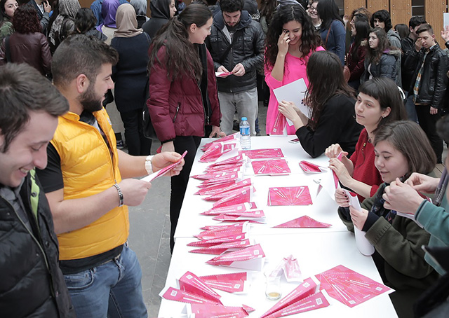 Pilots are polishing their paper airplane-folding techniques for a March 8 Women of Aviation Worldwide attempt to make the most paper airplanes in 15 minutes. Photo courtesy of Women in Aviation International.