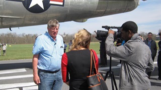 Karl Stoltzfus is beset by media after arriving in Texas. Photo courtesy of Mid America Flight Museum