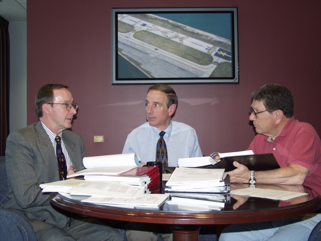 AOPA General Counsel John Yodice (right) canceled today's flight to Sun 'n Fun to continue Meigs battle planning with Phil Boyer and AOPA attorney Ron Golden.