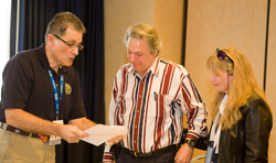 Dr. Warren Silberman of the FAA's medical staff (left) with Sandy Skolnick and his wife, Sharon