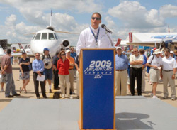 Mark Zakula of Klein Tools explains how the company uses its Falcon 50 business jet, seen behind him.