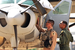 Lt. Col. Todd Dagget and an Iraqi student preflight a Cessna Caravan.