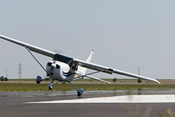 A Cessna 172 practicing cross landings.