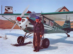 Olson and his Taylorcraft on skis on Golovin Bay