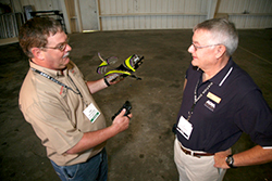 Stillman (left) and Marsh (right) go over the finer points of remote control flying.
