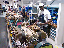 Teledyne Continental Motors Inc. employees work on the assembly line in Mobile, Ala.