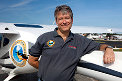 Michael Combs leans on the Hope One - the Remos he will fly to all 50 states.